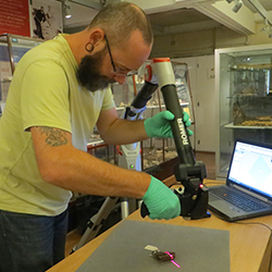 Archaeology Technician Lloyd Bosworth using a Romer Laser Scanner at the Petrie Museum, UCL.
