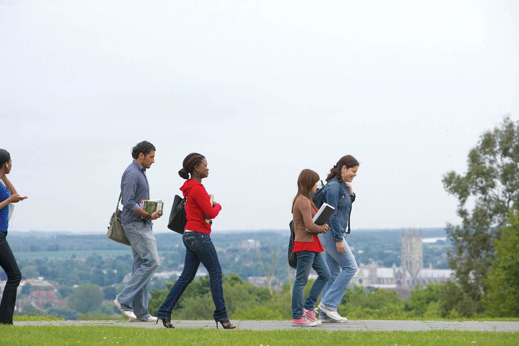 Students walking on Campus with Canterbury Cathedral in the background
