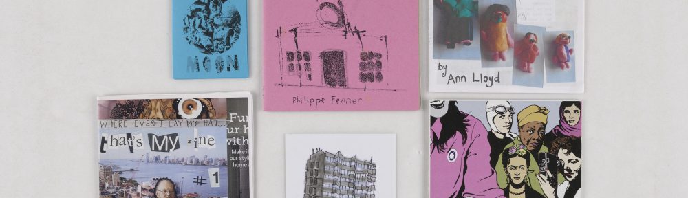A photograph of 6 items from the collection, their covers facing the viewer.