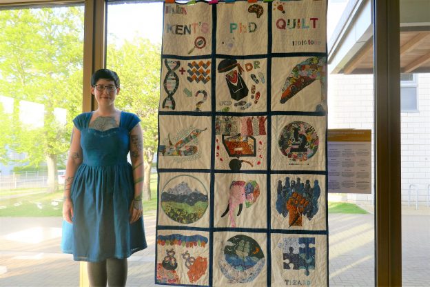 Laura Thomas-Walters and her PhD quilt