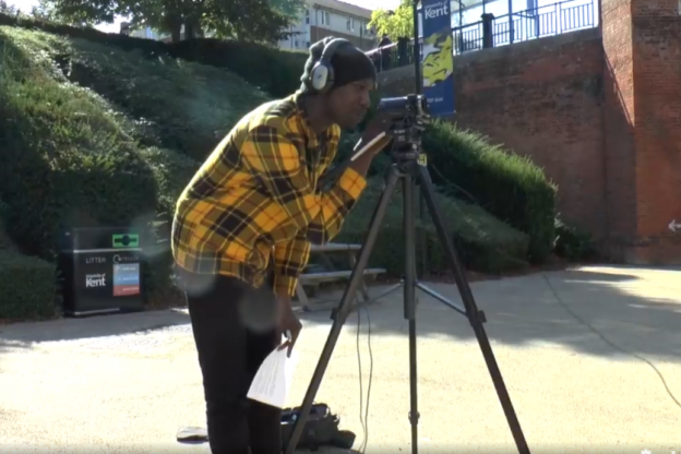 Student Ayomikun Adekaiyero filming on Medway campus