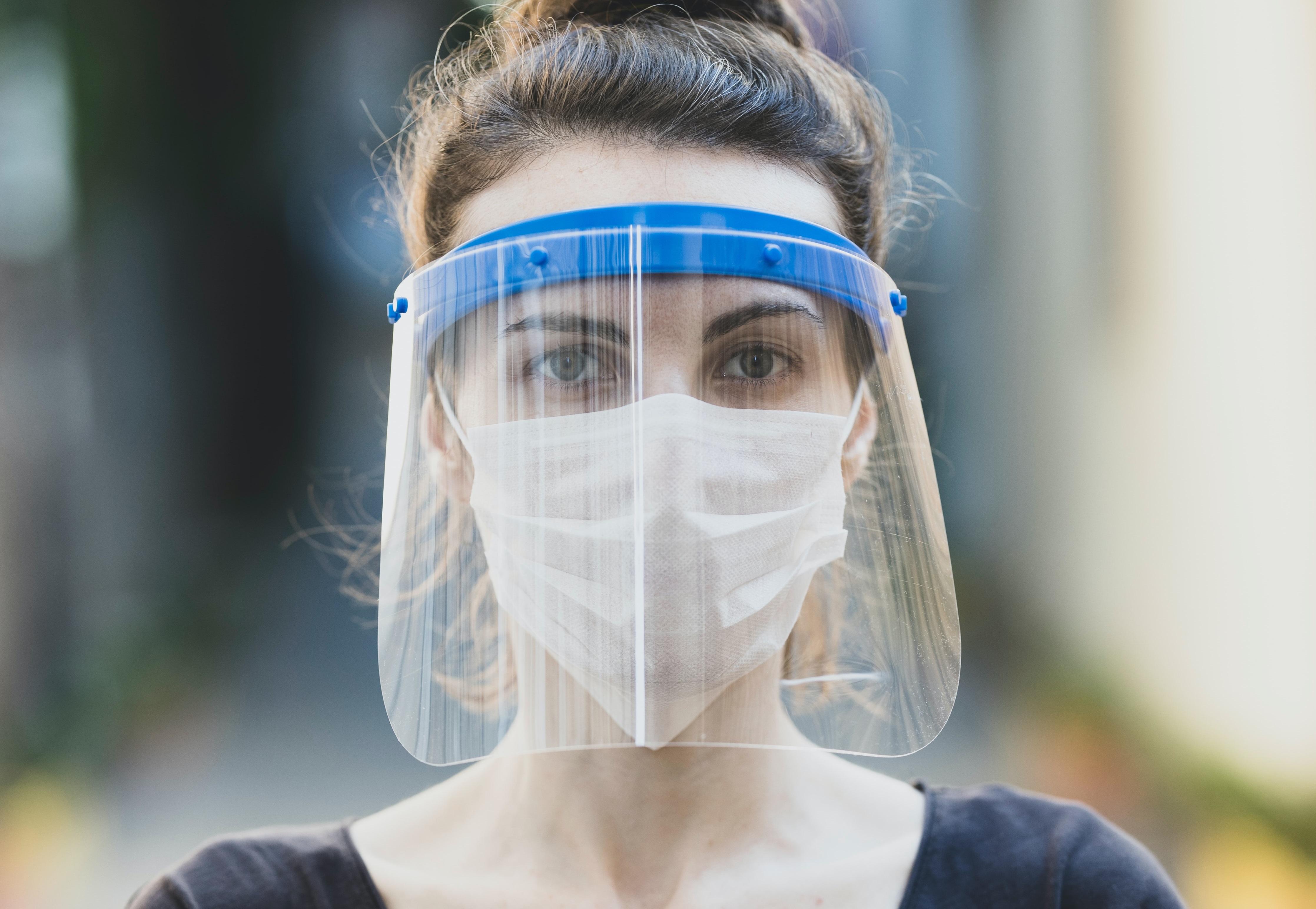 women in mask and face shield