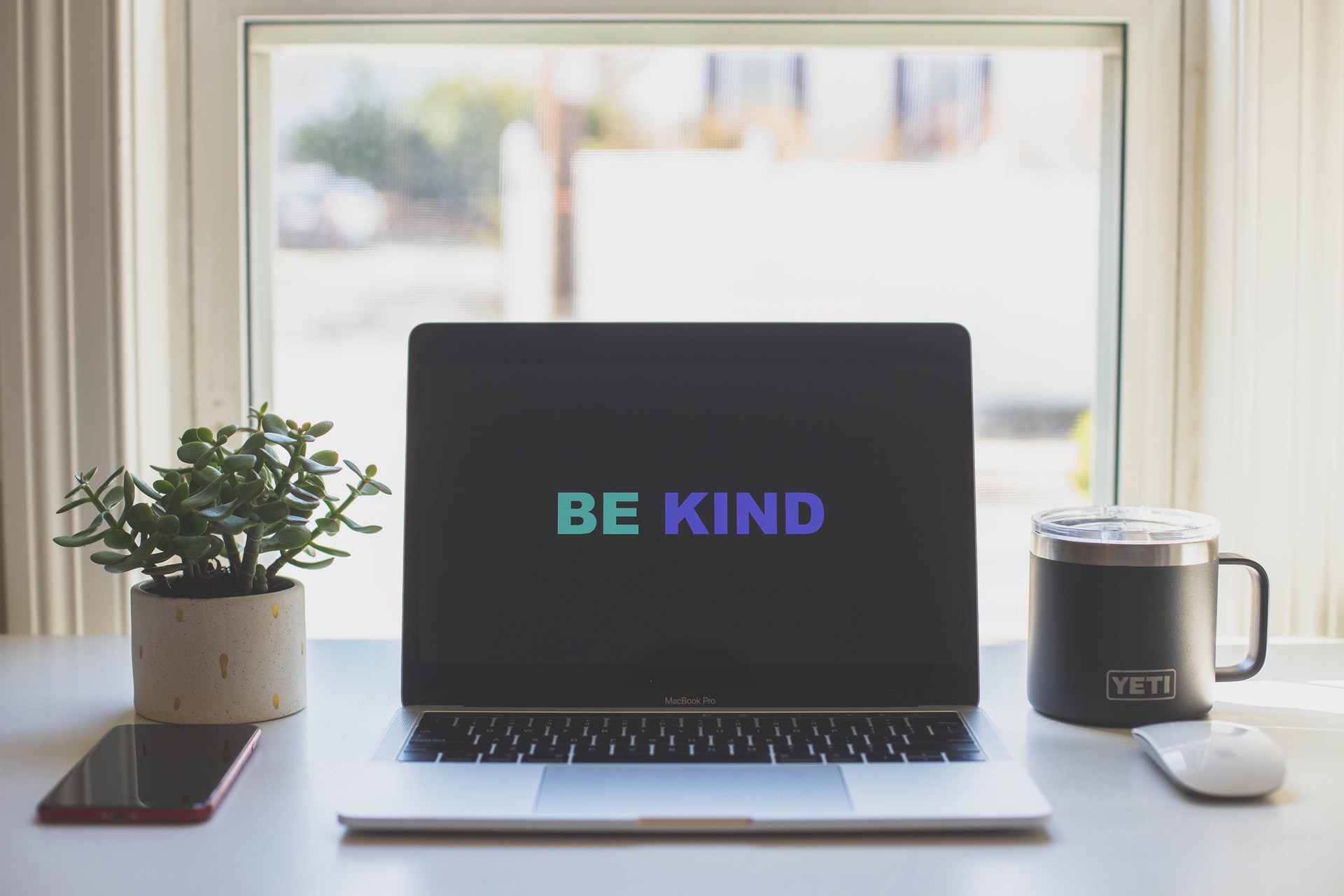 Computer screen saying "be kind"