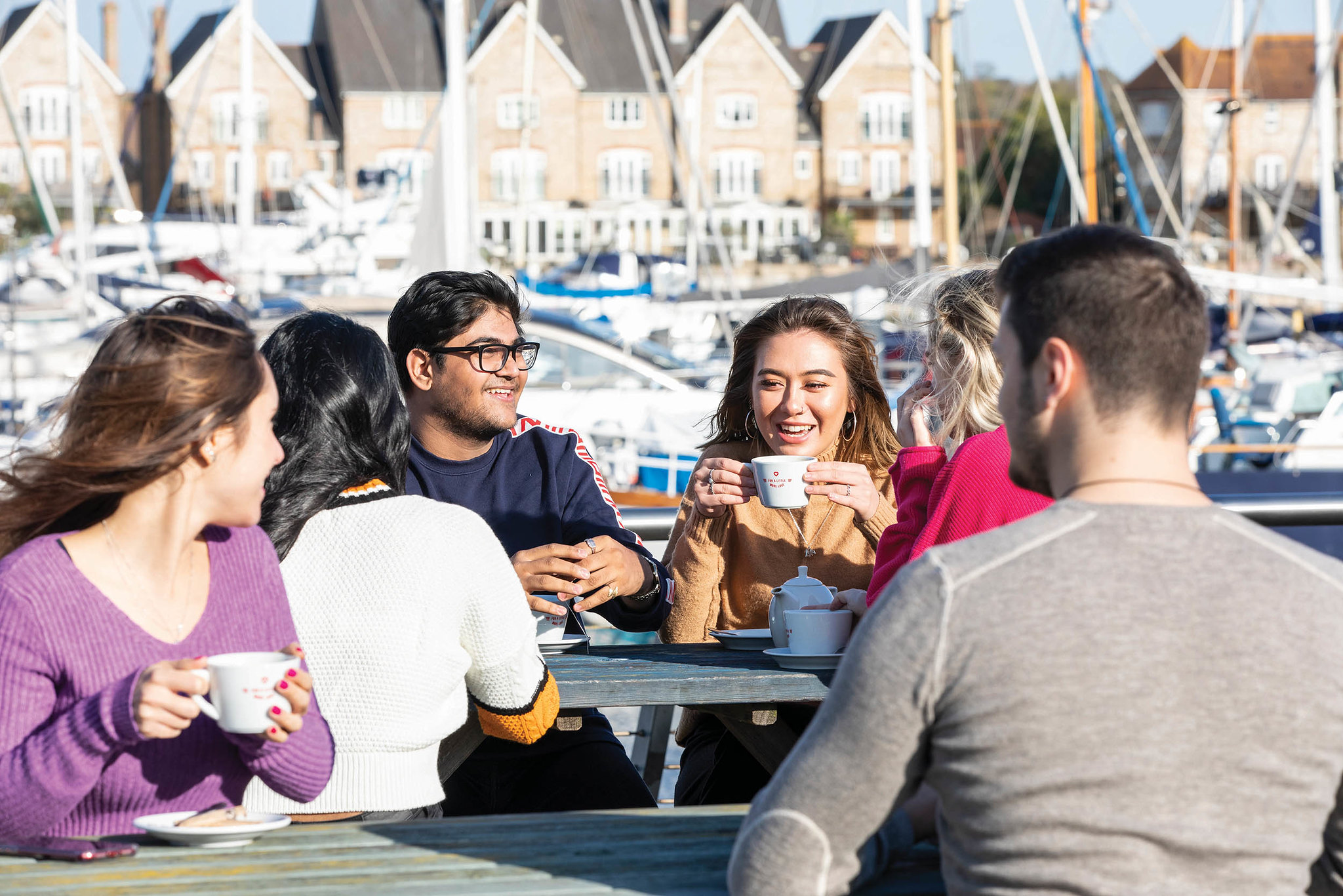 Students sat together drinking tea at the Dockyard