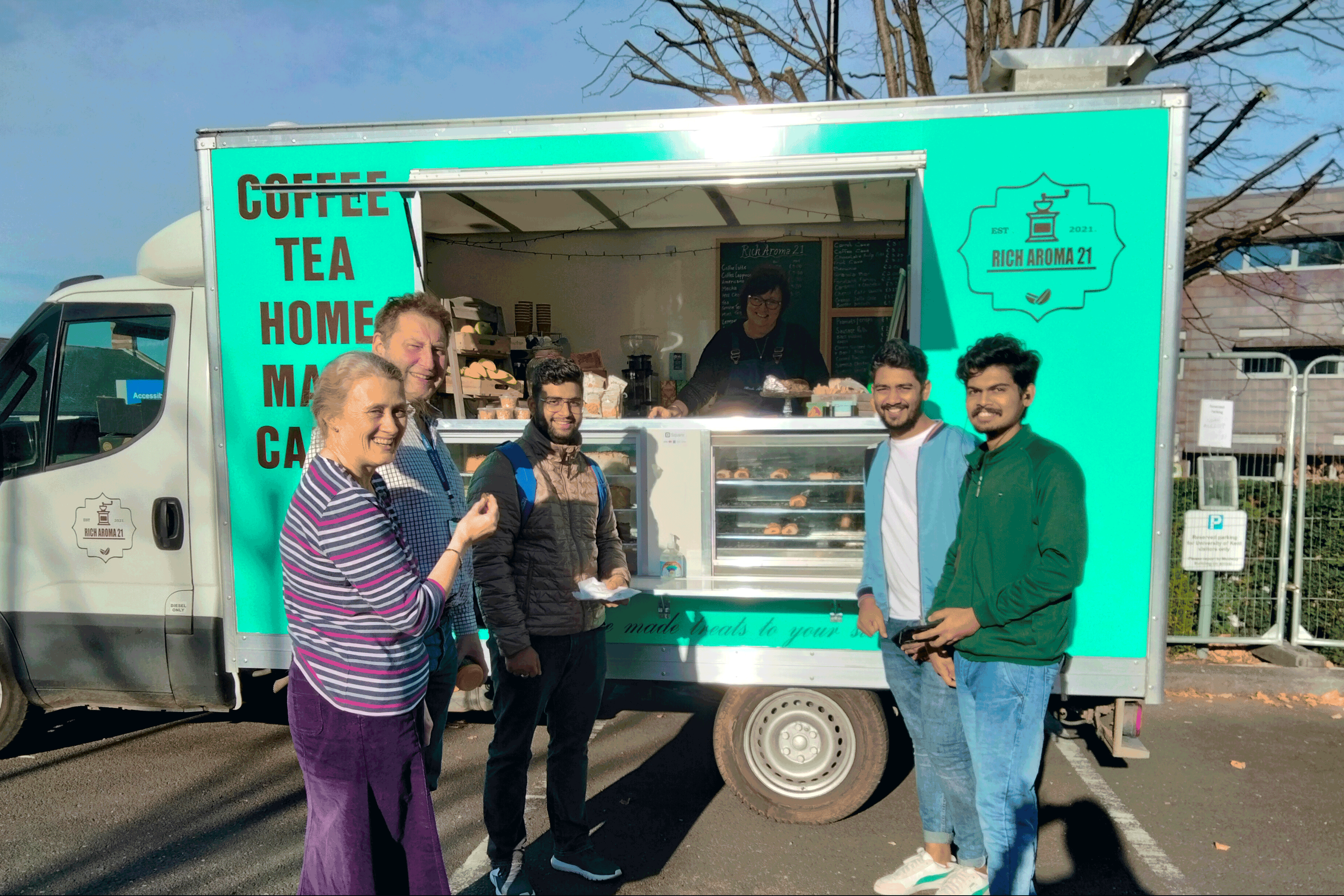 Students and staff outside new Rich Aroma 21 food truck