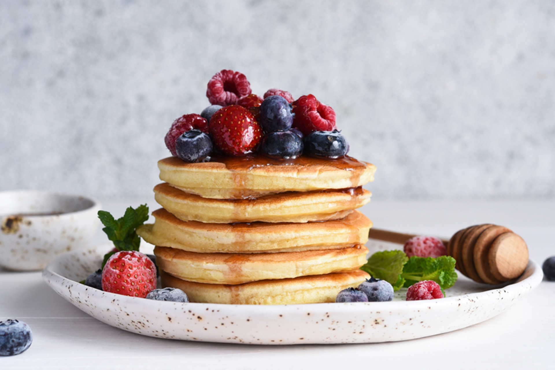 Stack of pancakes with berries on top