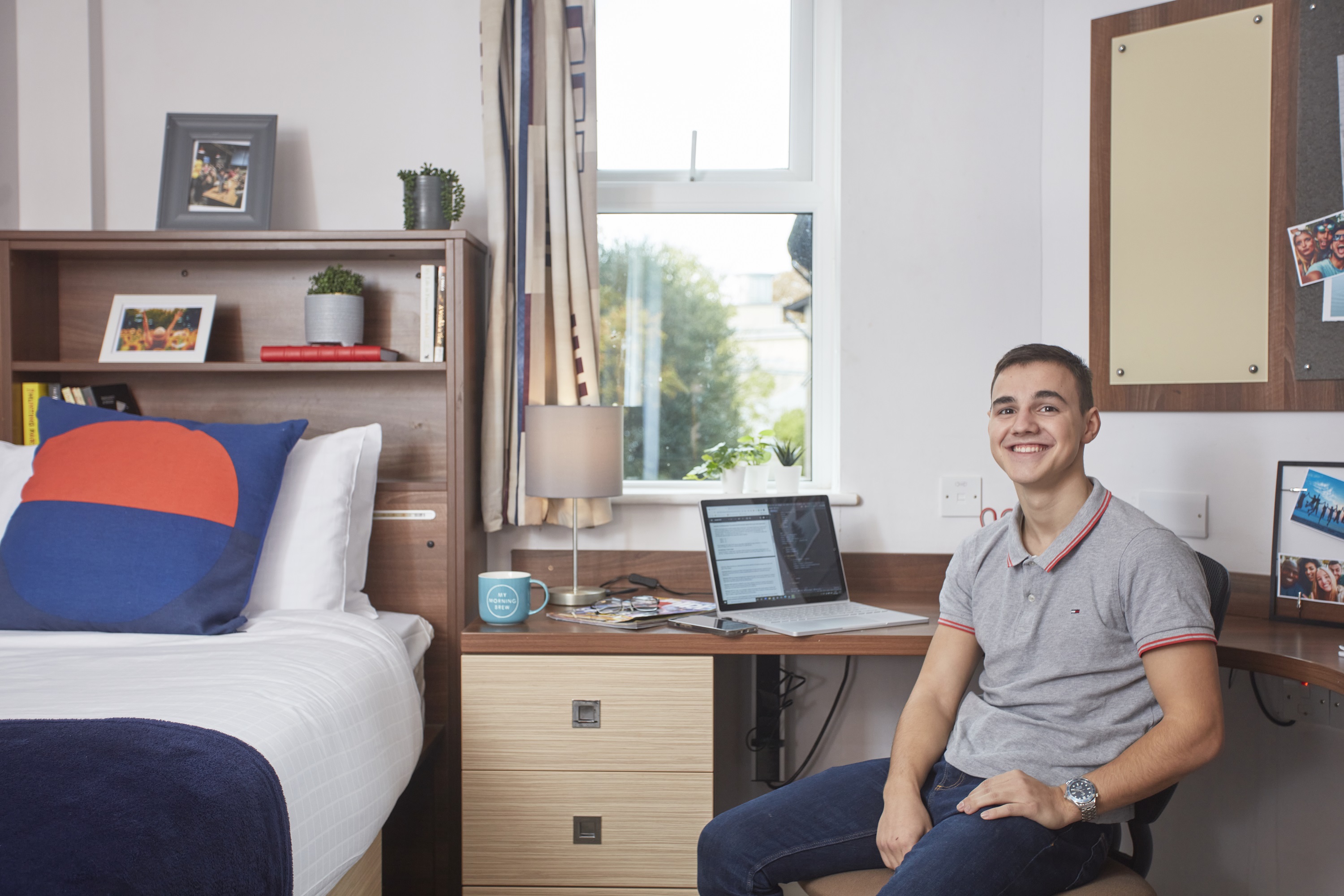 Student in accommodation smiling