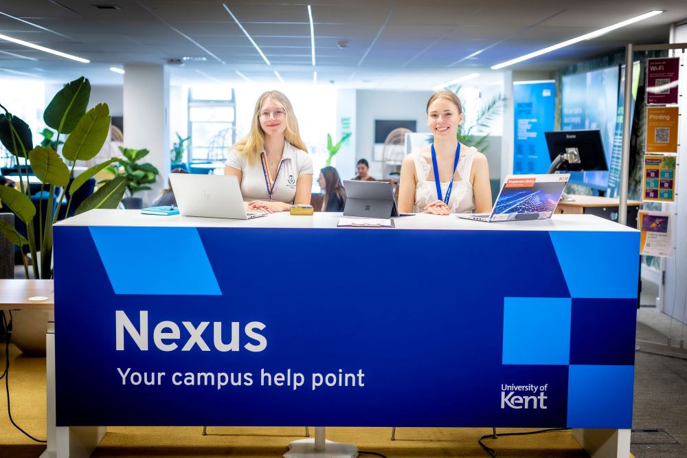 Nexus desk with staff smiling