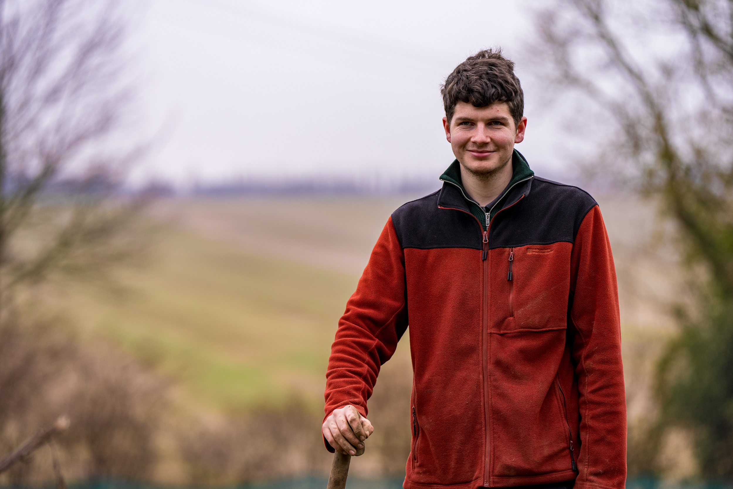 Student Jack Scott standing at his farm
