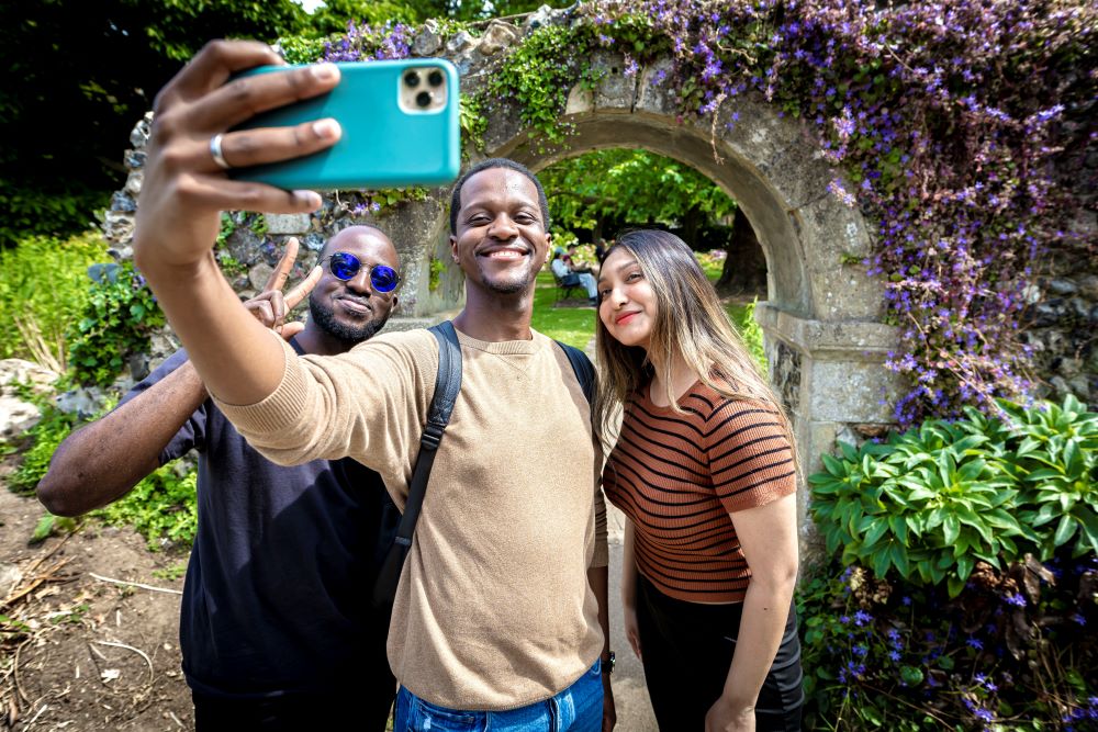 Students taking selfie in Westgate Gardens