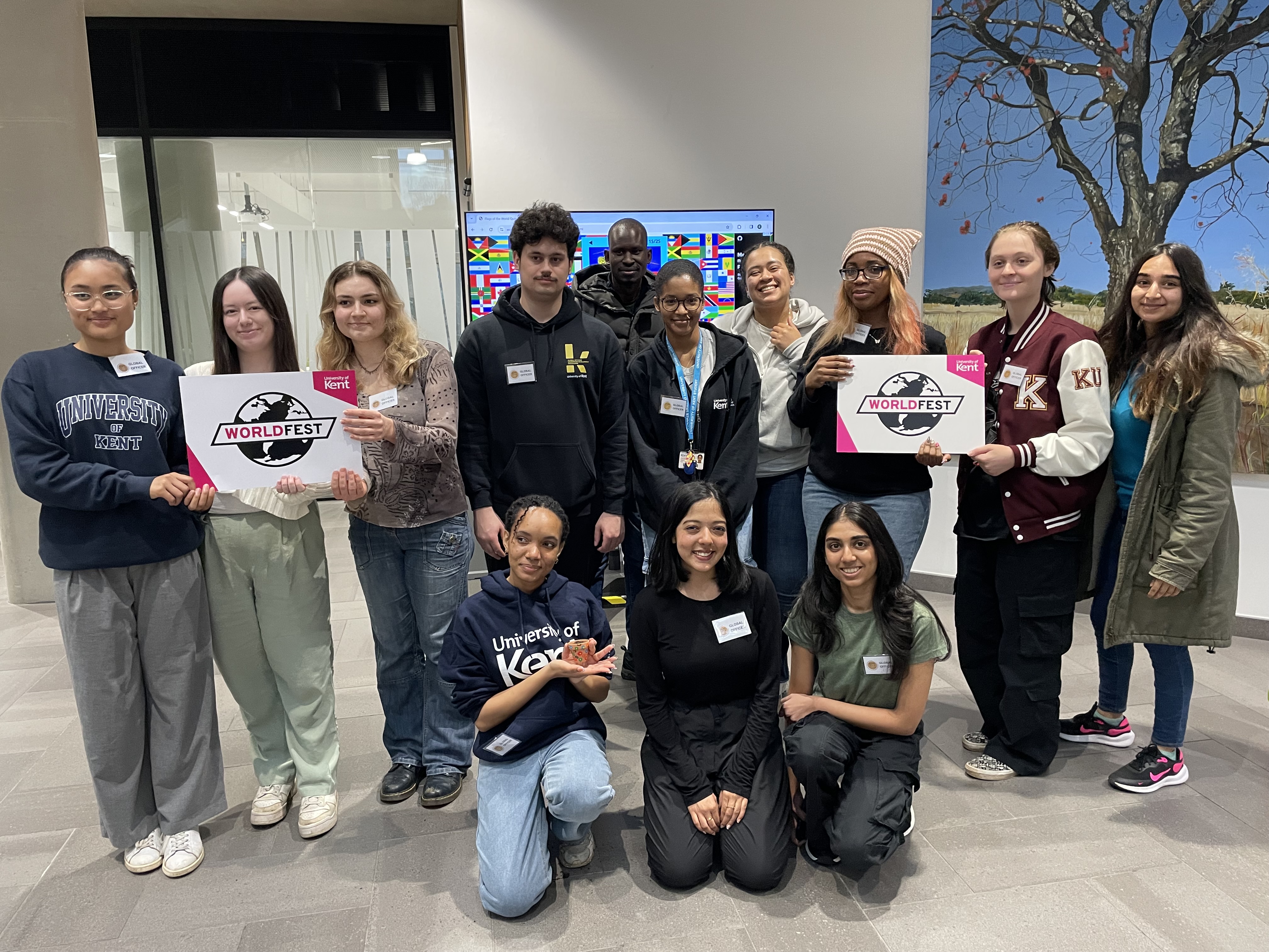 Group of Global Officers holding WorldFest signs