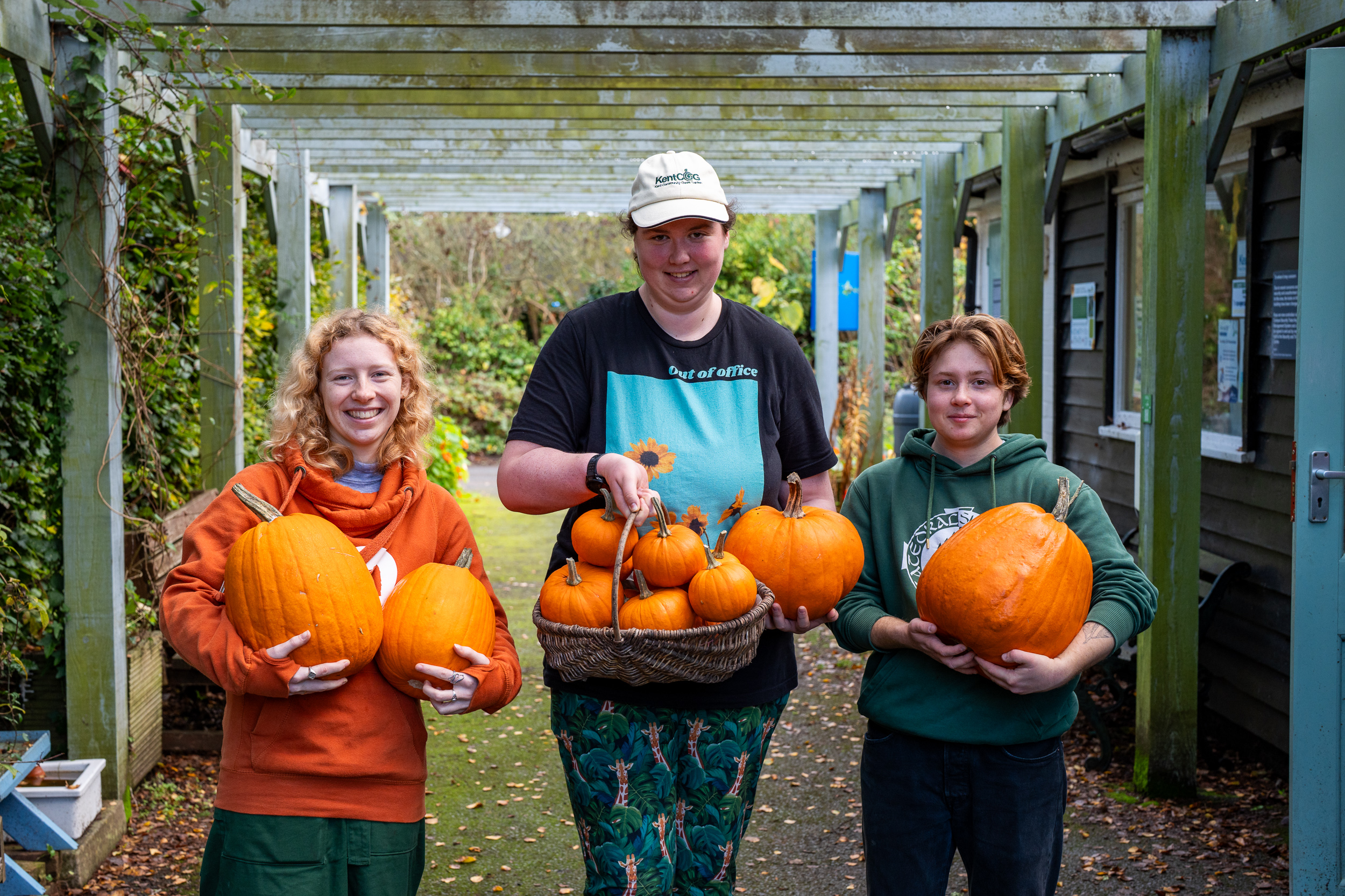 Students holding pumpkins grown at Kent Community Oasis Garden