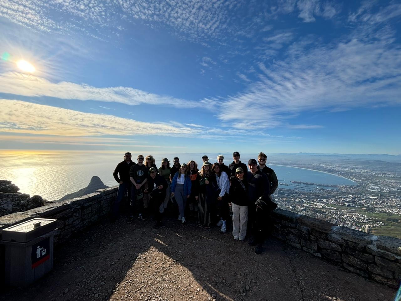 Group on trip abroad at high point with sea and city view