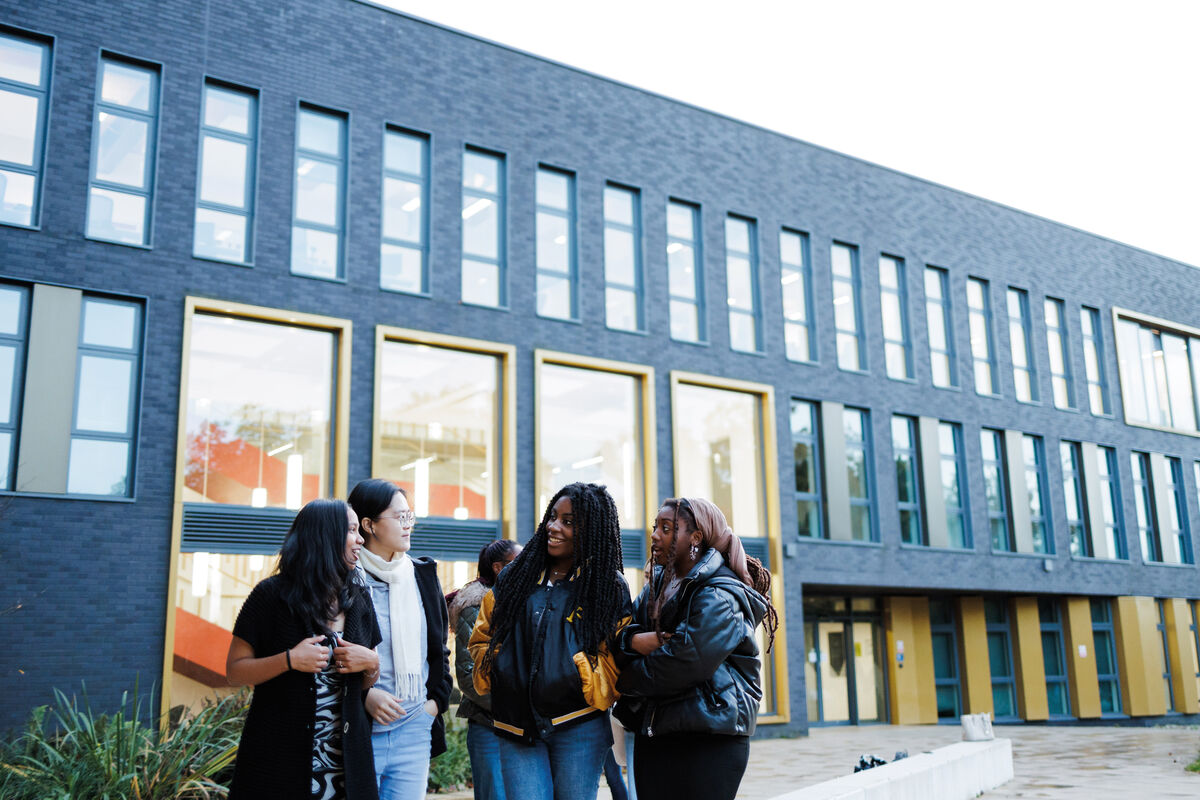 Students chatting outside Kennedy building