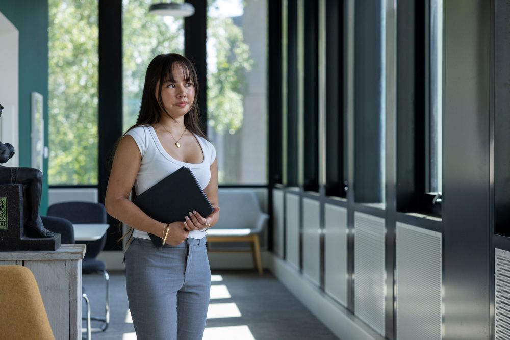 Student holding laptop
