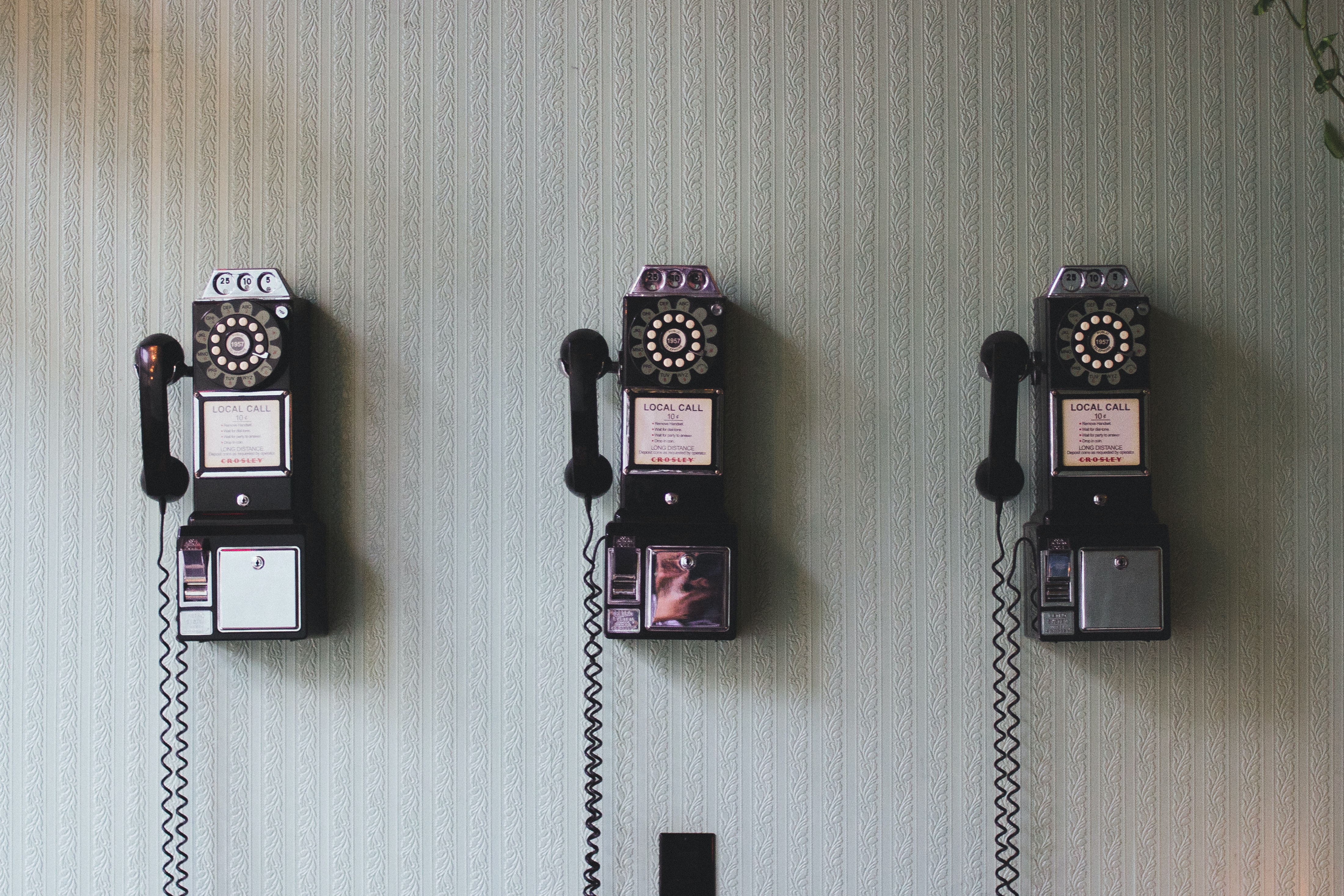 Three old telephones