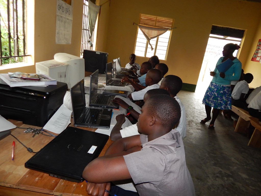 Pupils in Ugandan classroom at computers