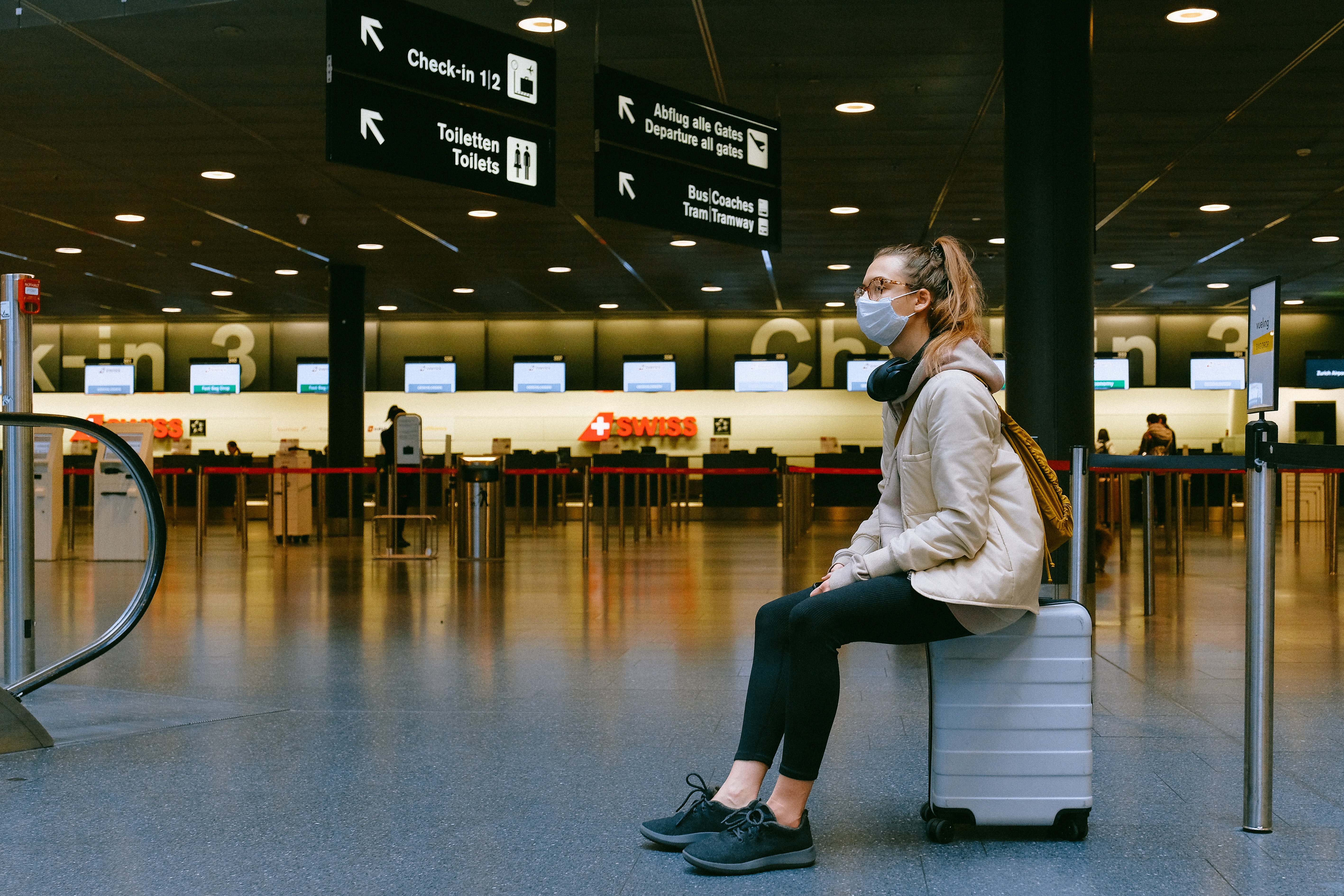 Woman in airport with mask