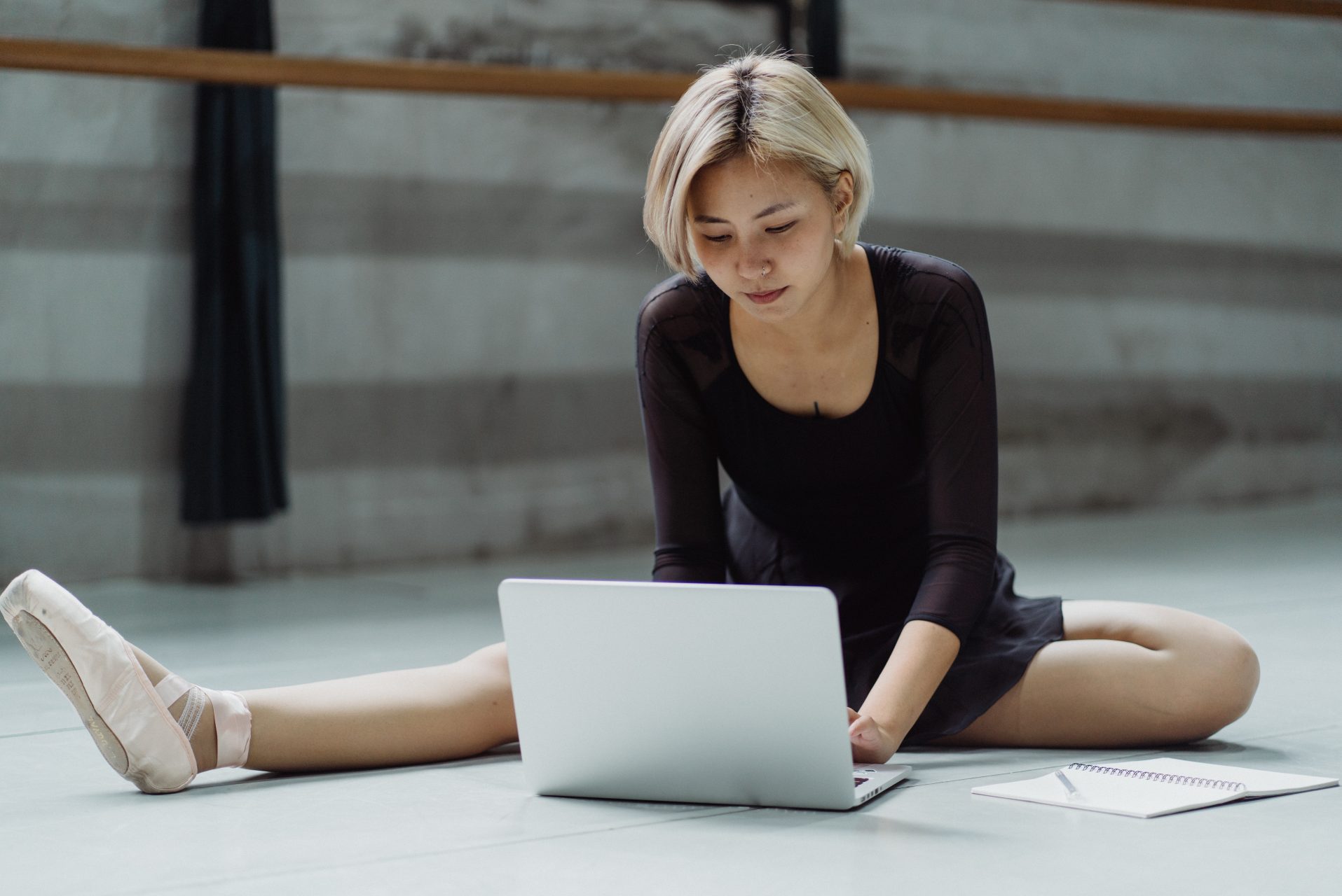 Ballerina using laptop